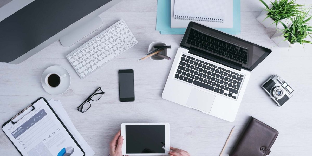 Top-down view of organized tech workspace